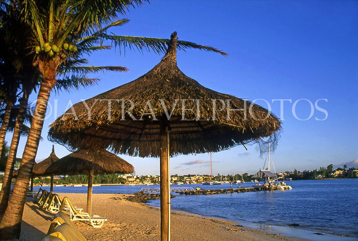 MAURITIUS, North Coast, beach near Grand Bay, thatched sunshades, MRU199JPL