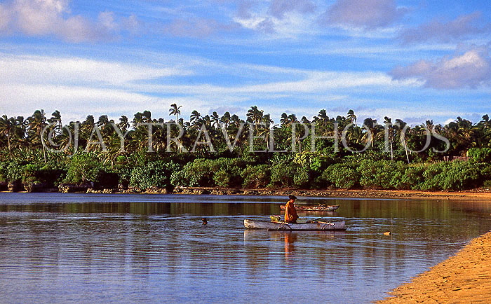 TONGA, Atata Island, coast and small boat, sunset, TON190JPL
