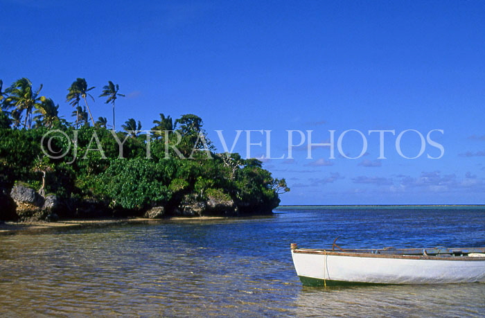 TONGA, Atata Island, coastal view, with small fishing boat, TON2240JPL