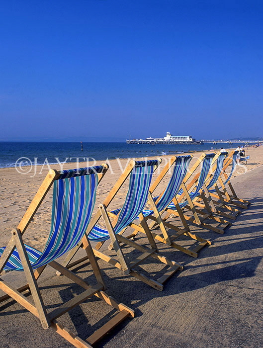 UK, Dorset, BOURNEMOUTH, deck chairs lined up along beachfront, DOR741JPL